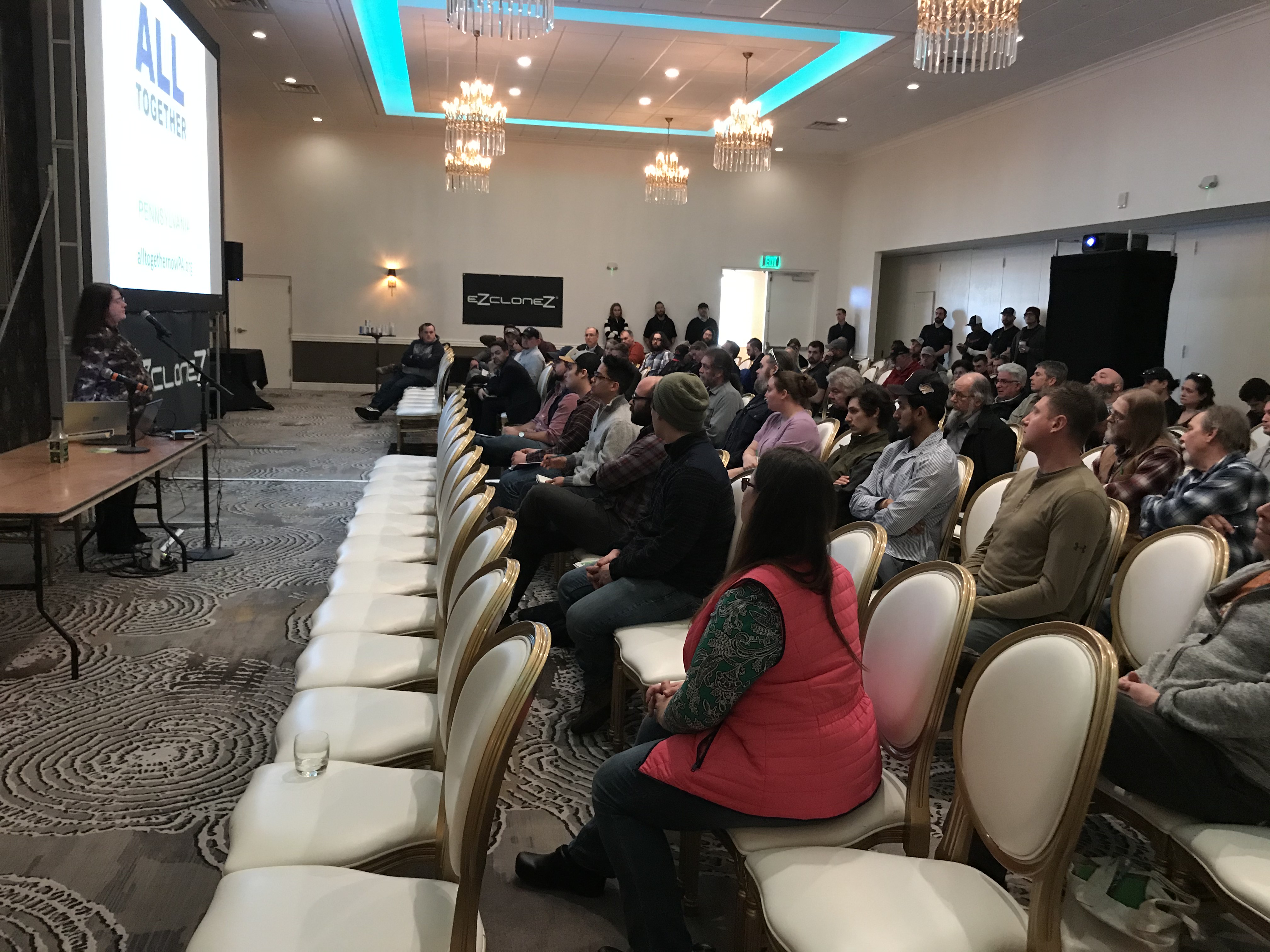 Attendees listening during a conference session